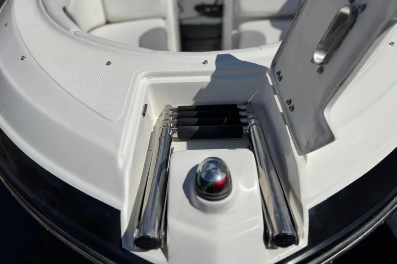 Slide: The Image of 2018 Rinker 23QX BR boat ladder and navigation light detail. - 13