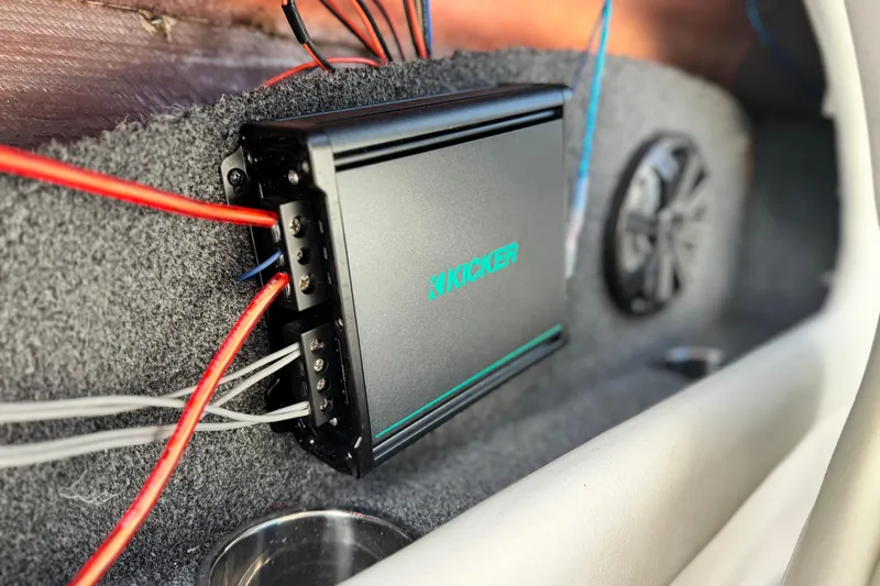 Slide: The Image of 2018 Rinker 23QX BR boat audio system with Kicker amplifier and speaker. - 22