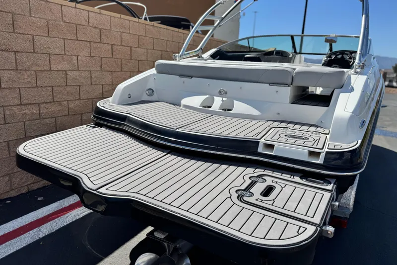 Slide: The Image of 2018 Rinker 23QX BR boat with spacious swim platform and sleek design. - 6