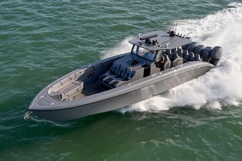 Slide: The Image of 2019 Midnight Express 43 Open boat cruising on open water, showcasing sleek design and powerful engines. - 10