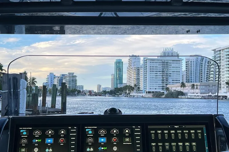 Slide: The Image of Cockpit view from 2019 Midnight Express 43 Open boat, overlooking waterfront cityscape. - 12