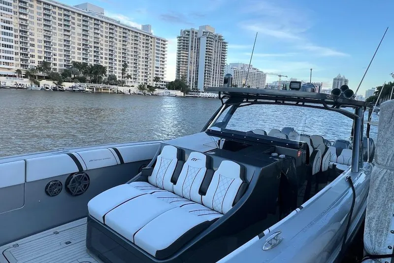 Slide: The Image of 2019 Midnight Express 43 Open boat docked by waterfront buildings. - 14