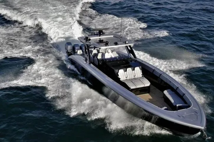 Slide: The Image of 2019 Midnight Express 43 Open boat cruising on open water, showcasing sleek design and powerful engines. - 2