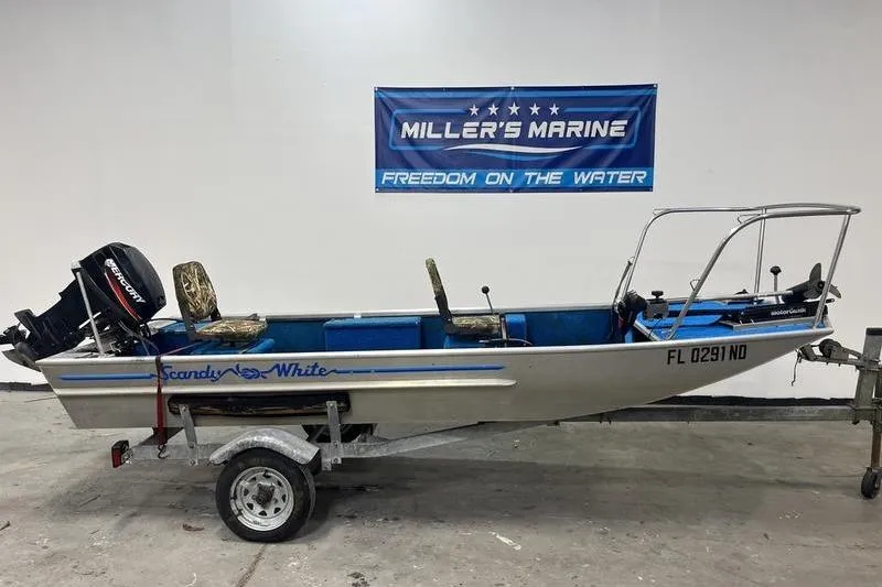 Slide: The Image of 2006 SCANDY WHITE 1310 boat on trailer at Miller's Marine showroom. - 0