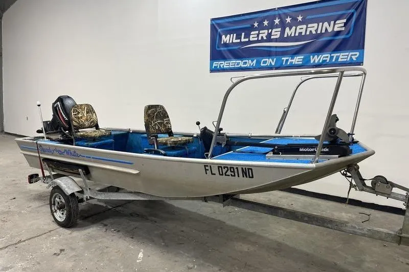 Slide: The Image of 2006 SCANDY WHITE 1310 boat on trailer at Miller's Marine showroom. - 1