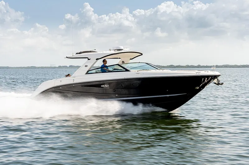 The Image of Manufacturer Provided Image: 2025 Sea Ray SLX 400 cruising on open water under a cloudy sky. - 0