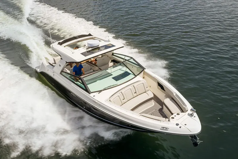 Slide: The Image of Manufacturer Provided Image: 2025 Sea Ray SLX 400 cruising on open water, showcasing sleek design and luxury features. - 1