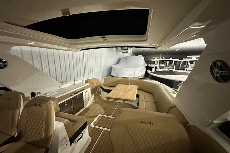 Slide: The Image of Luxurious interior of 2026 Sea Ray SLX 400 yacht with elegant seating and table. - 14