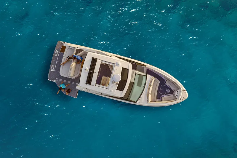 Slide: The Image of Manufacturer Provided Image: Aerial view of 2025 Sea Ray SLX 400 yacht on clear blue water. - 19
