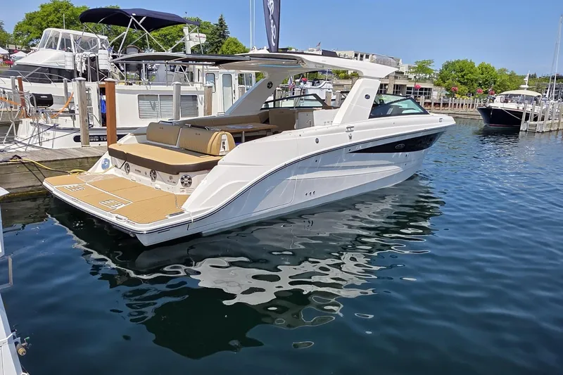 Slide: The Image of 2026 Sea Ray SLX 400 luxury boat docked at marina, sunny day. - 1