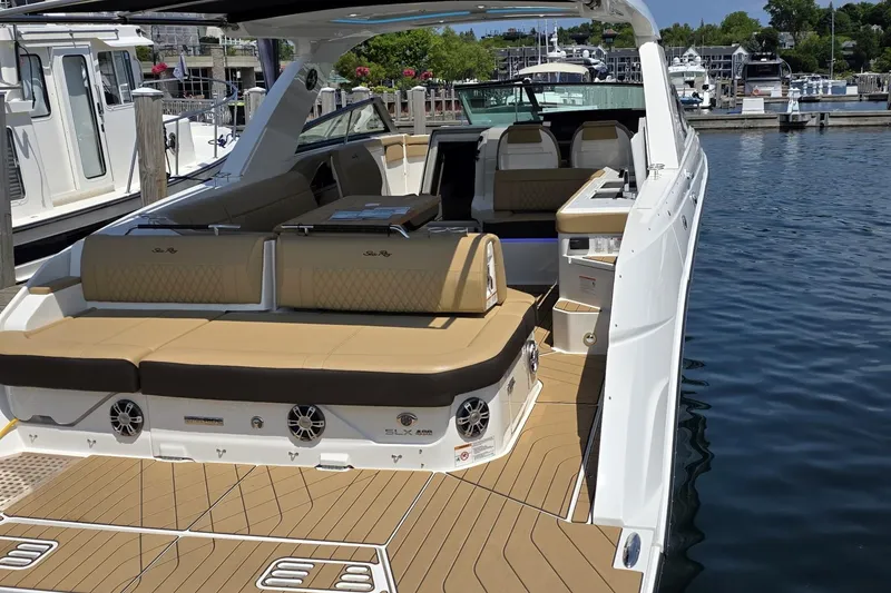 Slide: The Image of 2026 Sea Ray SLX 400 luxury boat docked at marina, featuring spacious seating and sleek design. - 4