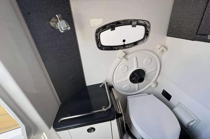 Slide: The Image of Interior of 2026 Monterey Elite 30 OB boat bathroom with modern fixtures. - 10