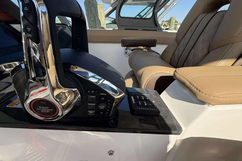 Slide: The Image of Luxury helm of 2026 Monterey Elite 30 OB with leather seating and advanced controls. - 13