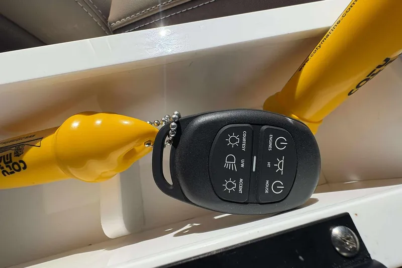 Slide: The Image of Remote control for 2026 Monterey Elite 30 OB boat, featuring various function buttons. - 15