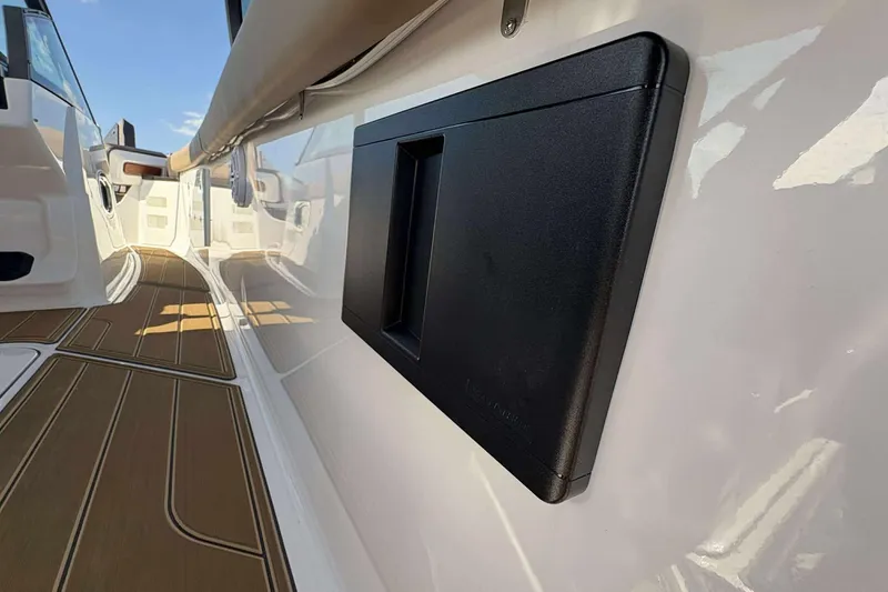 Slide: The Image of 2026 Monterey Elite 30 OB boat interior with sleek design and wood-textured flooring. - 17