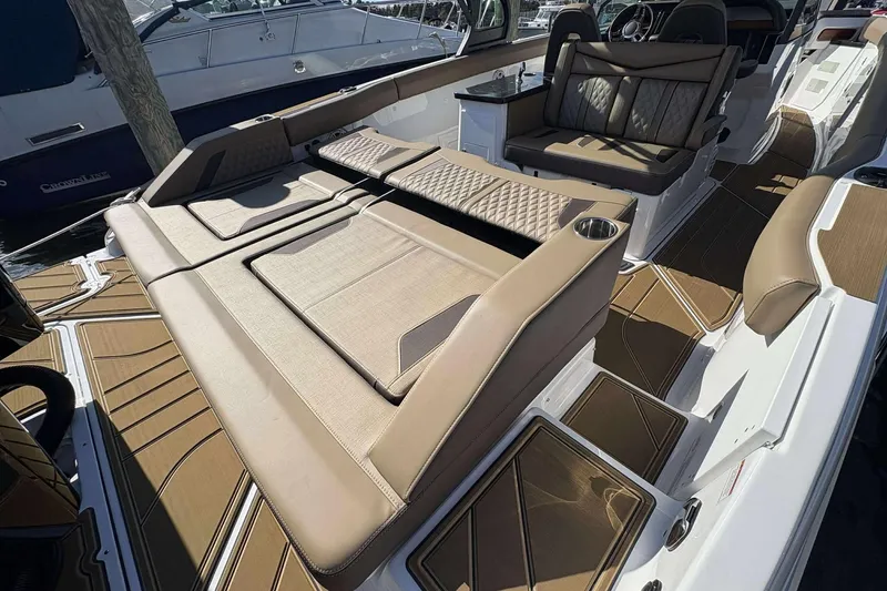 Slide: The Image of Luxurious 2026 Monterey Elite 30 OB boat interior with plush seating and modern design. - 20