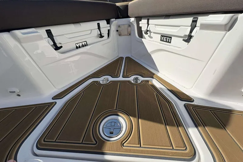 Slide: The Image of 2026 Monterey Elite 30 OB boat deck with Yeti coolers and stylish flooring. - 4