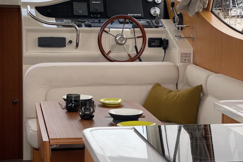 Slide: The Image of Interior of 2019 Greenline 33 Hybrid yacht with cozy seating and dining area. - 16