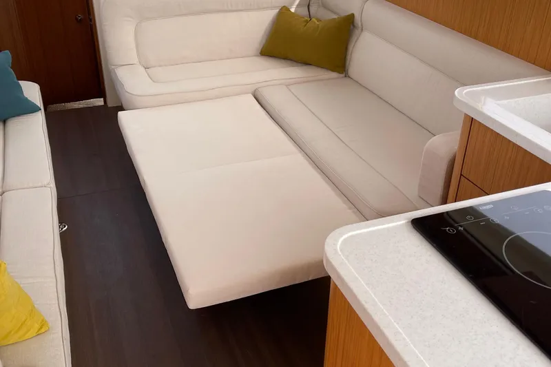 Slide: The Image of Interior of 2019 Greenline 33 Hybrid yacht with modern seating and kitchen area. - 17