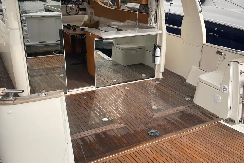 Slide: The Image of Interior view of 2019 Greenline 33 Hybrid yacht with wooden flooring and kitchenette. - 22