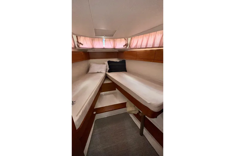 Slide: The Image of Cozy cabin interior of 2019 Greenline 33 Hybrid yacht with twin beds and soft lighting. - 26