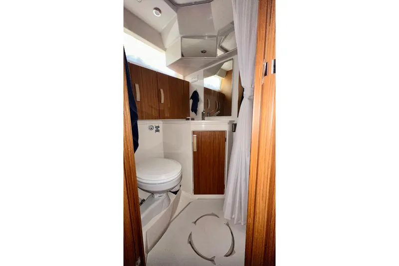 Slide: The Image of 2019 Greenline 33 Hybrid yacht bathroom with wooden cabinetry and modern fixtures. - 30