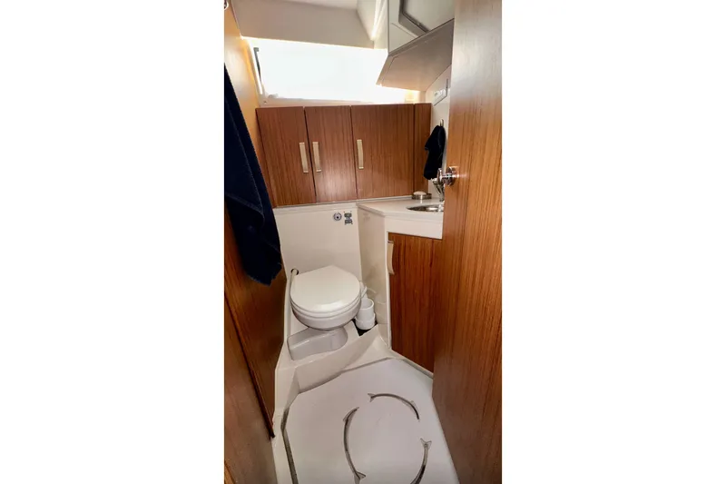 Slide: The Image of 2019 Greenline 33 Hybrid yacht bathroom with wooden cabinetry and compact design. - 31
