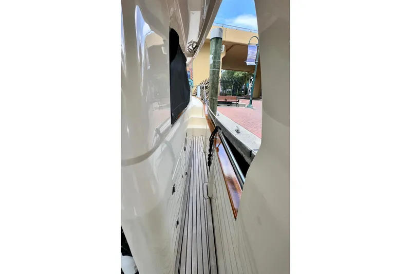 Slide: The Image of Side view of 2019 Greenline 33 Hybrid yacht docked at marina. - 33