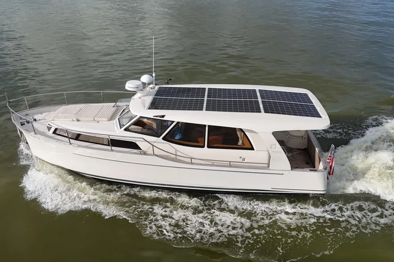 Slide: The Image of 2019 Greenline 33 Hybrid yacht cruising with solar panels on roof. - 1