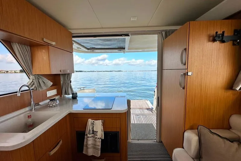 Slide: The Image of Interior of 2019 Greenline 33 Hybrid yacht with kitchen and ocean view. - 17