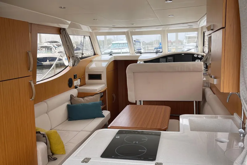 Slide: The Image of Interior of 2019 Greenline 33 Hybrid yacht with modern kitchen and seating area. - 7