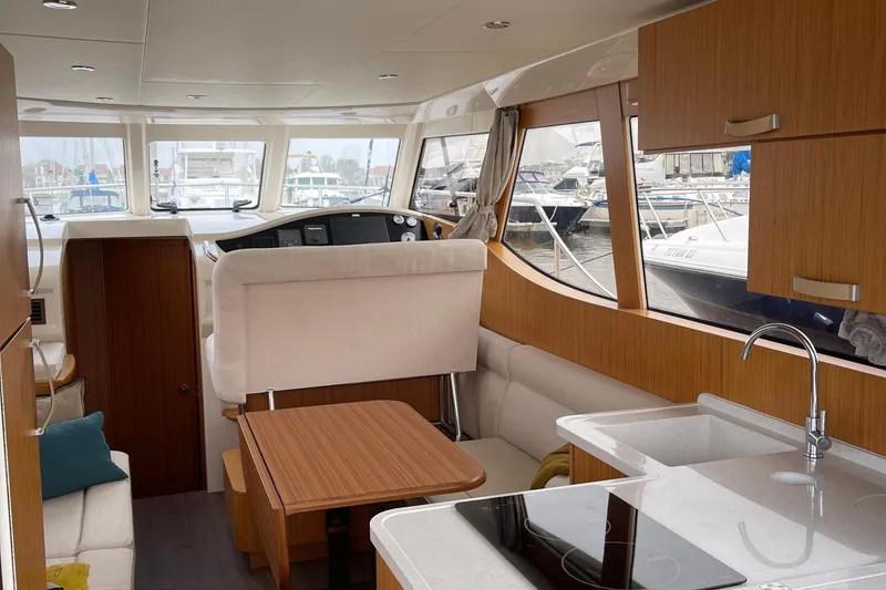 Slide: The Image of Interior of 2019 Greenline 33 Hybrid yacht with modern kitchen and seating area. - 8