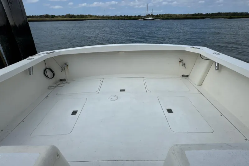Slide: The Image of 1985 Blackfin 32 Flybridge boat deck with open water view. - 27