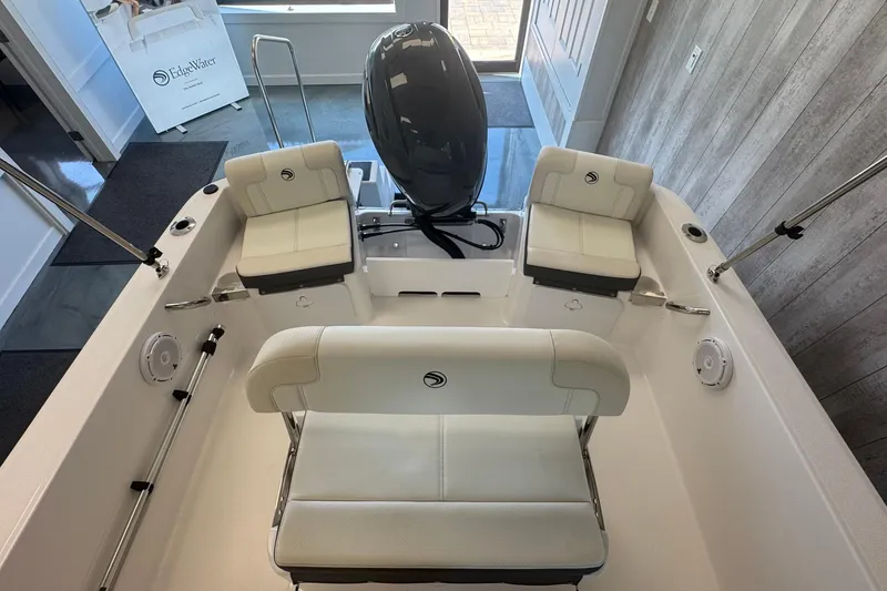 Slide: The Image of 2025 Edgewater 170CC boat interior with white seating and modern design. - 7