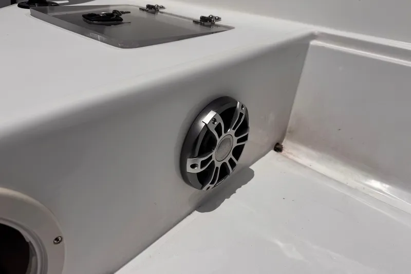 Slide: The Image of Boston Whaler 170 Montauk 1980 boat interior with speaker and storage compartment. - 12