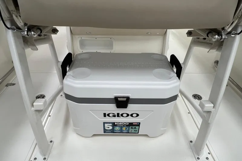 Slide: The Image of 2024 Boston Whaler 230 Outrage with Igloo cooler under seat. - 13