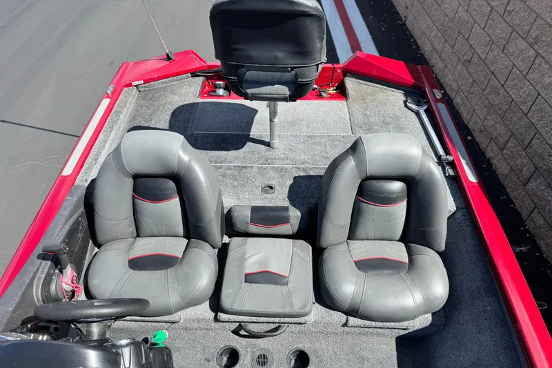 Slide: The Image of 2022 Tracker Pro Team 175 TXW boat interior with gray seats and red accents. - 13