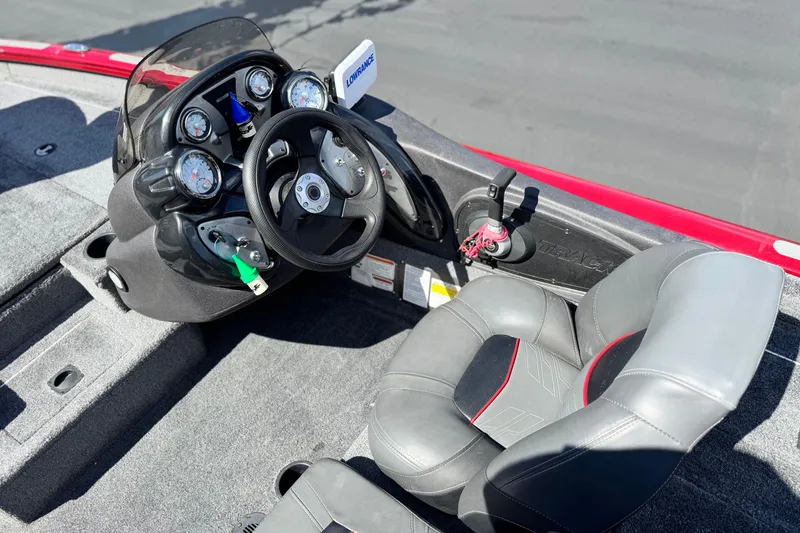 Slide: The Image of 2022 Tracker Pro Team 175 TXW boat cockpit with steering wheel and gauges. - 15