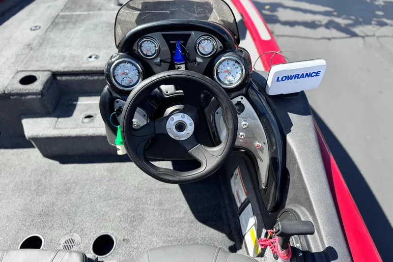 Slide: The Image of 2022 Tracker Pro Team 175 TXW boat dashboard with steering wheel and Lowrance device. - 16
