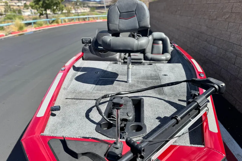 Slide: The Image of 2022 Tracker Pro Team 175 TXW boat with red exterior and fishing seat. - 7