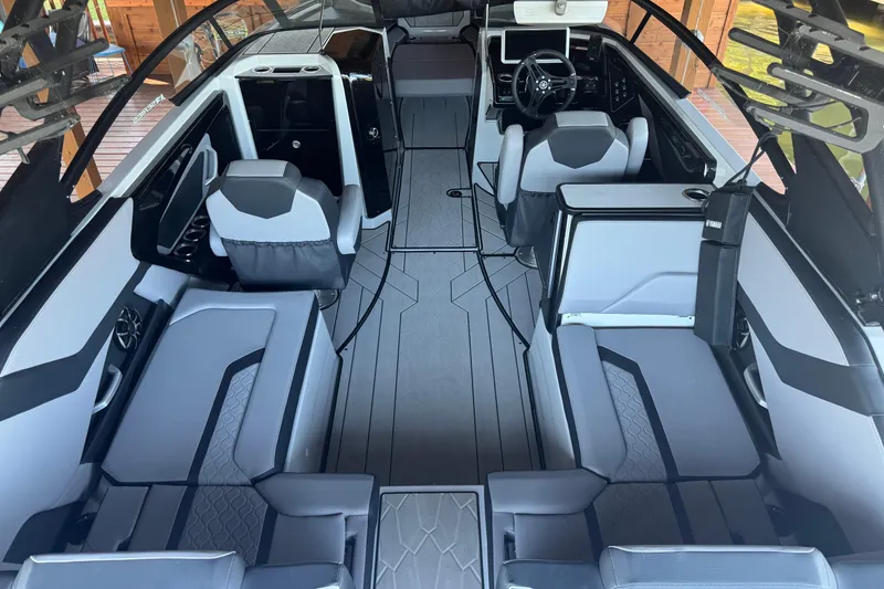 Slide: The Image of 2024 Yamaha Boats 255XE interior with modern seating and sleek design. - 8