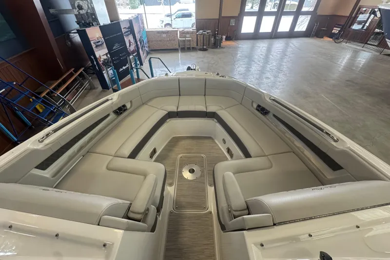 Slide: The Image of 2026 Sea Ray SLX 310 boat interior with spacious seating and modern design. - 13