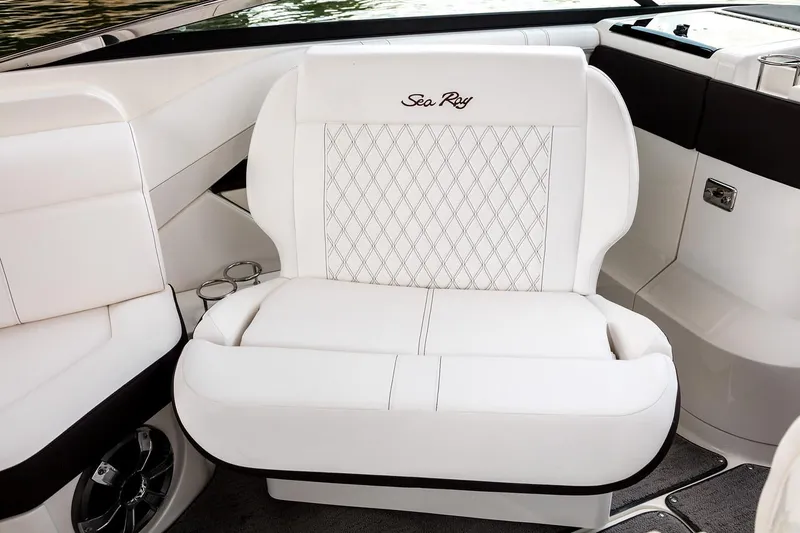 Slide: The Image of Luxurious interior of 2026 Sea Ray SLX 310 boat with plush seating and modern dashboard. - 8