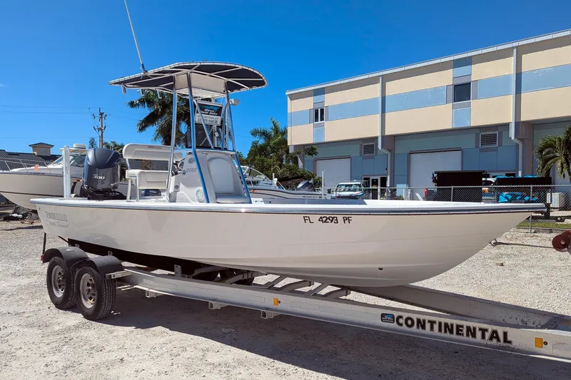 Slide: The Image of 2011 Pathfinder 2400 Tournament Edition boat on trailer, parked outdoors. - 0