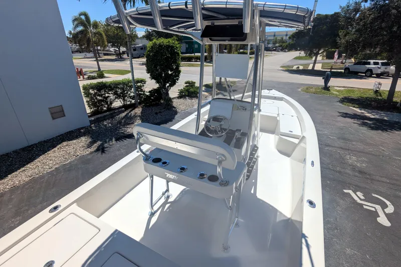 Slide: The Image of 2011 Pathfinder 2400 Tournament Edition boat with center console and T-top in a sunny outdoor setting. - 11