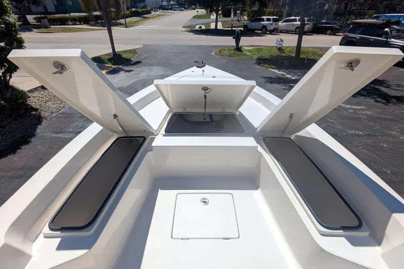 Slide: The Image of 2011 Pathfinder 2400 Tournament Edition boat with open storage compartments. - 12