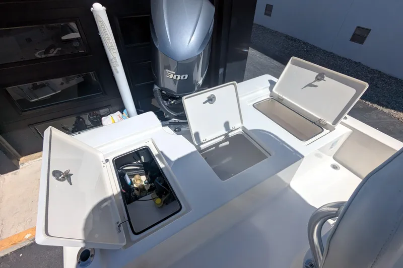 Slide: The Image of 2011 Pathfinder 2400 Tournament Edition boat with open storage compartments and Yamaha 300 engine. - 14