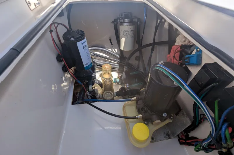 Slide: The Image of 2011 Pathfinder 2400 Tournament Edition boat engine compartment with wiring and components. - 15