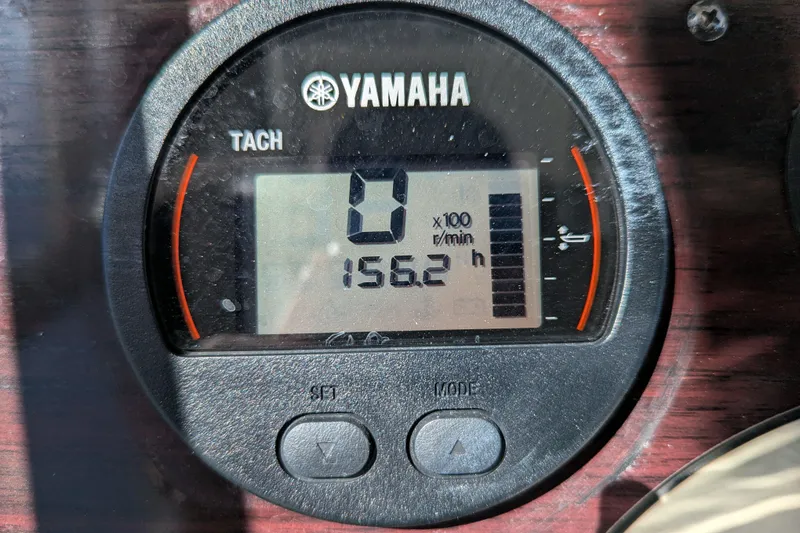 Slide: The Image of Yamaha tachometer displaying 156.2 hours on a 2011 Pathfinder 2400 Tournament Edition boat. - 17