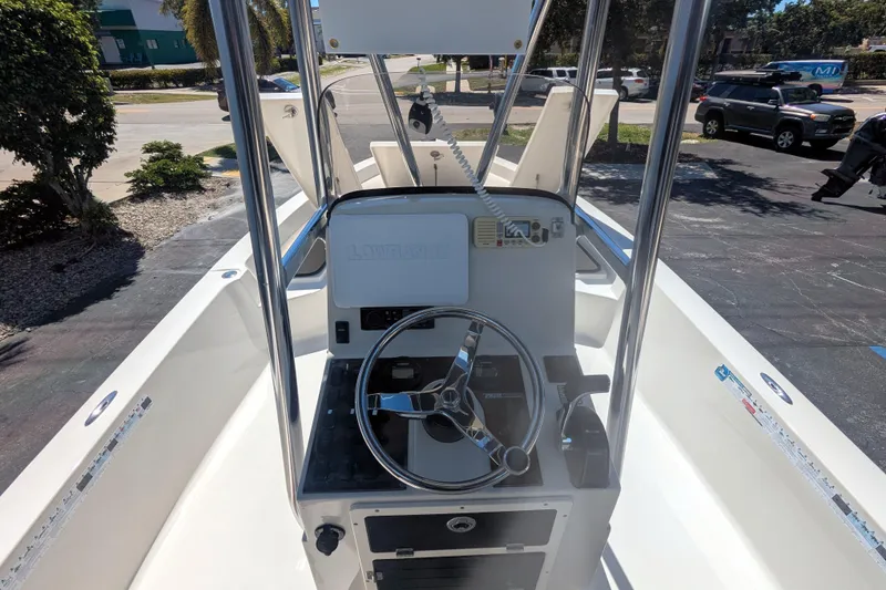 Slide: The Image of 2011 Pathfinder 2400 Tournament Edition boat interior with steering console and seating. - 9